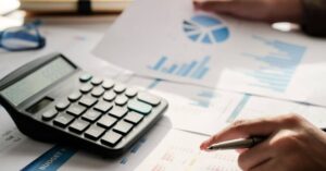 person calculating expenses