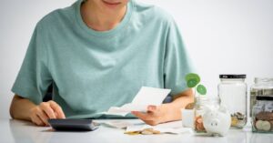 How Debt Settlement Works
In order to arrive at a lump-sum payment that is less than the total amount you owe, the debt settlement company might negotiate with your creditor. They can ask you to deposit money on a regular basis into an account that you control and that is overseen by a separate third party throughout this negotiating process. The money that is saved for the lump-sum payout goes into this account.
In addition, the debt settlement company can suggest that you cease paying your creditors until a settlement is made. You must accept the settlement and give the creditor or debt collector at least one payment in the settled amount after an agreement is reached between the debt settlement firm and your creditors that modifies the conditions of at least one of your obligations. Only then can the debt settlement company begin charging you fees for their services.
Is Debt Settlement Worth It?
So is debt settlement worth it? Escaping debt requires disciplined action and a commitment to changing previous bad habits, but it’s the only way to transform your financial life. Are you ready for a change? Are you ready to eliminate your debt once and for all, in less time and for less money than any other available options?
woman going over her finances